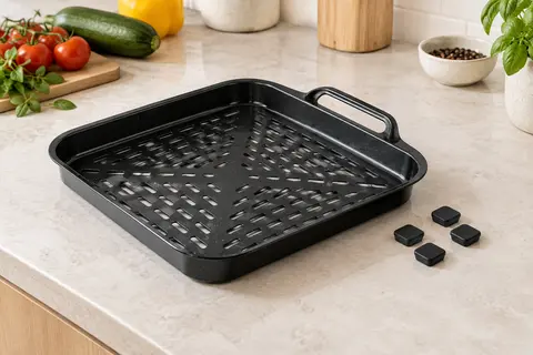 Plaque de cuisson noire pour friteuse à air avec poignée et quatre pare-chocs en caoutchouc